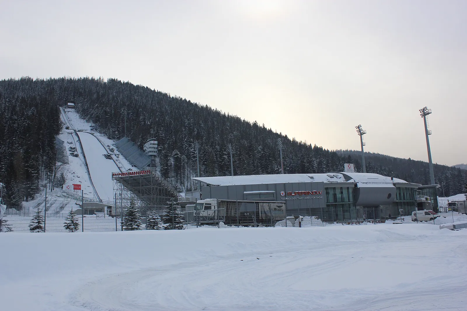 The Wielka Krokiew ski jump and its stands among snow-covered forest