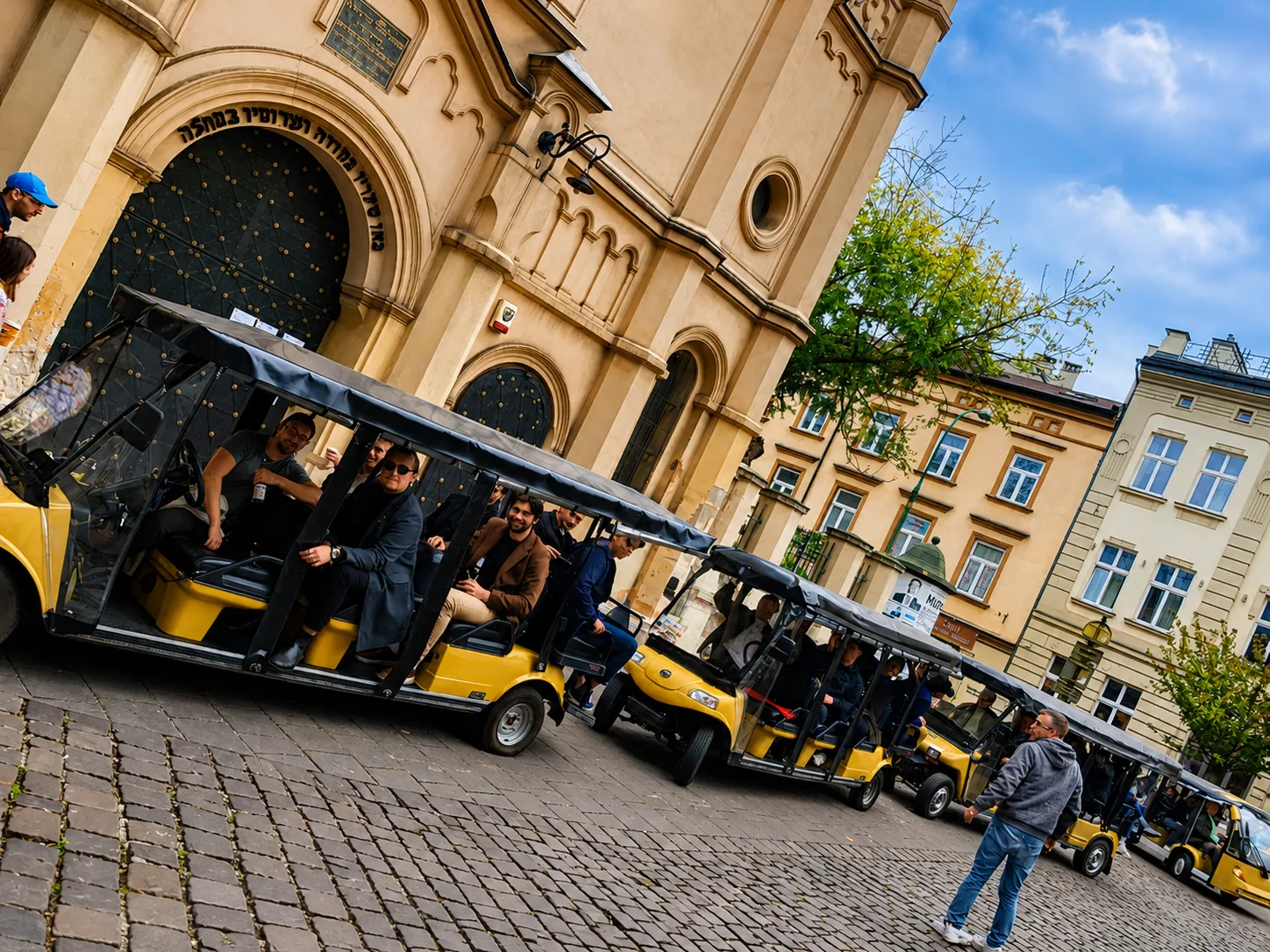 YourKrakow electric carts by a synagogue in Kazimierz, Krakow