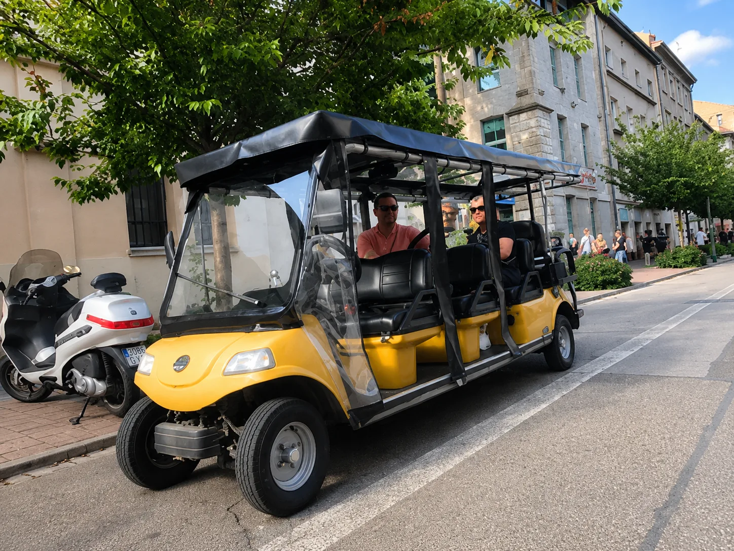 YourKrakow electric cart with passengers on a Krakow street