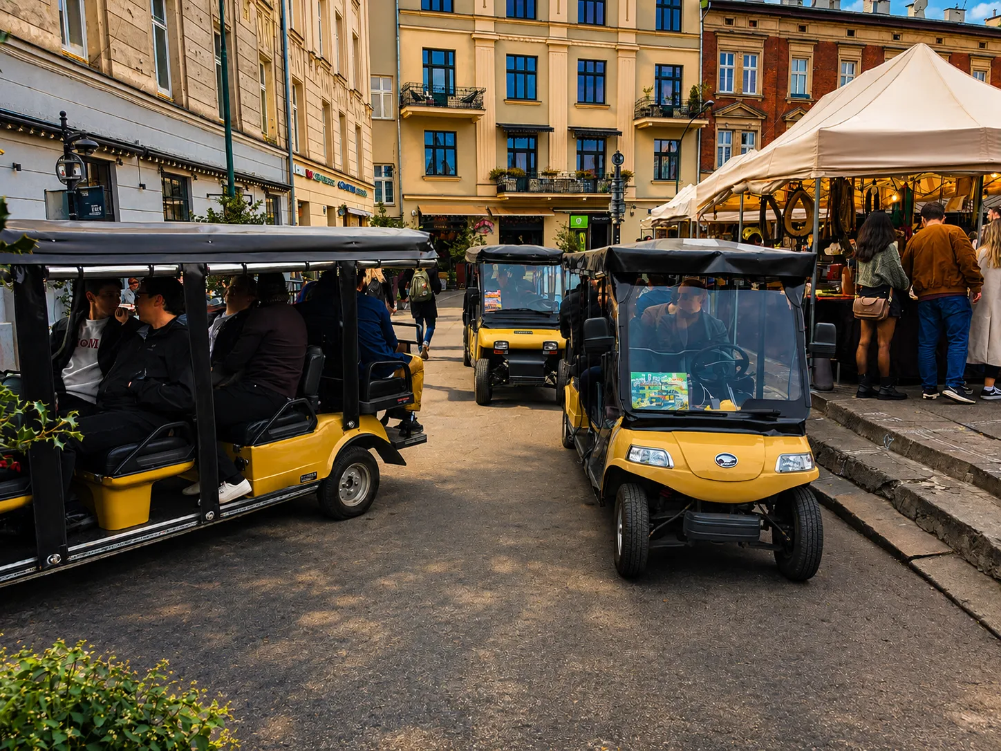 Electric melex carts on a square in Kazimierz, Krakow