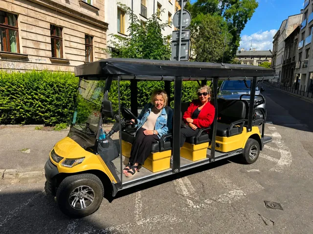 YourKrakow electric cart with passengers on a Krakow street