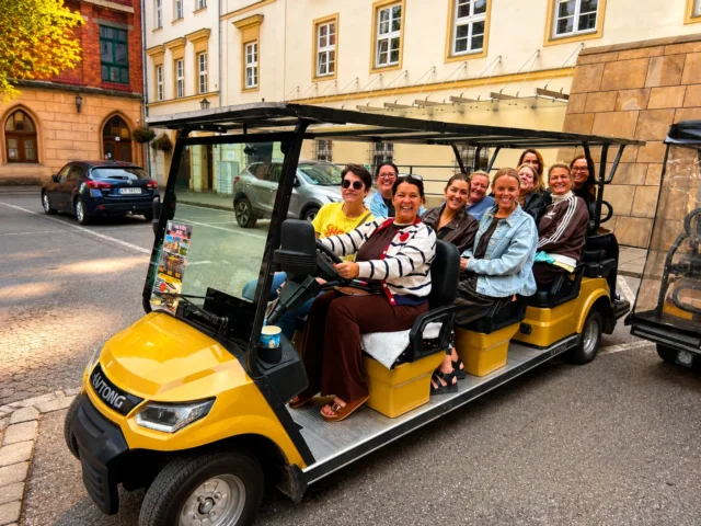 Smiling group on a YourKrakow melex sightseeing tour